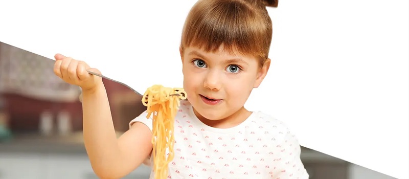 Child eating spaghetti